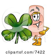 Bandaid Bandage Mascot Cartoon Character With A Green Four Leaf Clover On St Paddys Or St Patricks Day