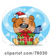Poster, Art Print Of Thoughtful Christmas Bear Holding A Present In The Snow