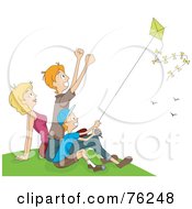 Mom Dad And Boy Flying A Kite On A Hill