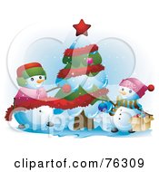 Royalty Free RF Clipart Illustration Of Happy Snowmen Decorating Their Christmas Tree In The Snow