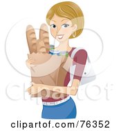 Pretty Blond Woman Carrying A Grocery Bag With Bread