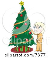 Blond Girl In Her Pajamas Decorating A Christmas Tree