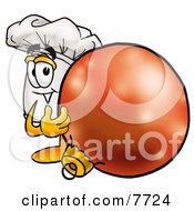 Chefs Hat Mascot Cartoon Character Standing With A Christmas Bauble