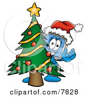 Desktop Computer Mascot Cartoon Character Waving And Standing By A Decorated Christmas Tree by Mascot Junction