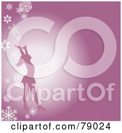 Silhouetted Female Figure Skater Holding Her Arms Up On A Pink Background With Falling Snowflakes