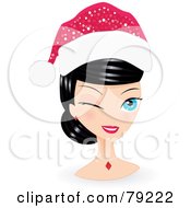 Black Haired Blue Eyed Christmas Woman Winking And Wearing A Santa Hat