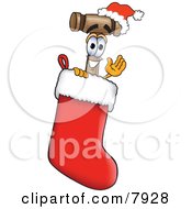 Clipart Picture Of A Mallet Mascot Cartoon Character Wearing A Santa Hat Inside A Red Christmas Stocking