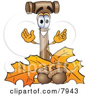 Clipart Picture Of A Mallet Mascot Cartoon Character With Autumn Leaves And Acorns In The Fall