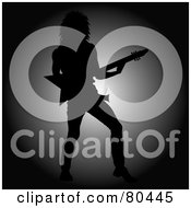 Royalty Free RF Clipart Illustration Of A Silhouetted Rock Star Man Playing An Electric Guitar Against A Light by Pams Clipart