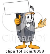 Rubber Tire Mascot Cartoon Character Holding A Blank Sign