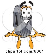 Clipart Picture Of A Rubber Tire Mascot Cartoon Character Sitting by Mascot Junction