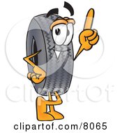 Clipart Picture Of A Rubber Tire Mascot Cartoon Character Pointing Upwards