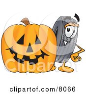 Rubber Tire Mascot Cartoon Character With A Carved Halloween Pumpkin by Mascot Junction