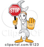Clipart Picture Of A Wrench Mascot Cartoon Character Holding A Stop Sign by Mascot Junction