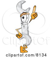 Clipart Picture Of A Wrench Mascot Cartoon Character Pointing Upwards