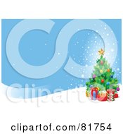 Poster, Art Print Of Christmas Tree With Presents On A Snowy Hill Under A Blue Sky