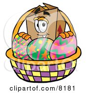 Cardboard Box Mascot Cartoon Character In An Easter Basket Full Of Decorated Easter Eggs