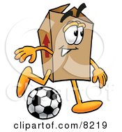 Cardboard Box Mascot Cartoon Character Kicking A Soccer Ball
