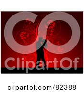 Black Kissing Couple Silhouette Over A Red Floral Swirl Background