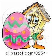 House Mascot Cartoon Character Standing Beside An Easter Egg