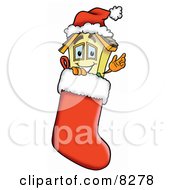House Mascot Cartoon Character Wearing A Santa Hat Inside A Red Christmas Stocking by Mascot Junction