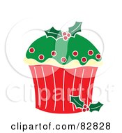 Royalty Free RF Clipart Illustration Of A Christmas Cupcake With Green Frosting Red Dots And Holly Candies