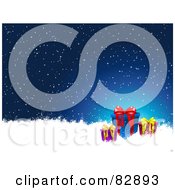 Royalty Free Clipart Illustration Of Three Christmas Presents In Snow Under A Snowy Night Sky