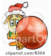 Poster, Art Print Of House Mascot Cartoon Character Wearing A Santa Hat Standing With A Christmas Bauble
