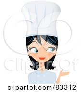 Royblack Haired Blue Eyed Female Chef Presenting With Her Hand