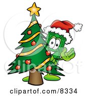 Dollar Bill Mascot Cartoon Character Waving And Standing By A Decorated Christmas Tree