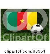 3d Soccer Ball Resting In The Grass In Front Of A Reflective Cameroon Flag