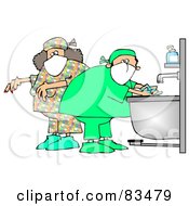 Male And Female Surgeons Washing Their Hands And Preparing For A Procedure