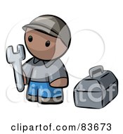 Black Human Factor Contractor Man Holding A Wrench And Standing By A Toolbox
