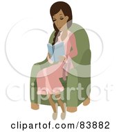 Relaxed Hispanic Woman Wearing A Robe Sitting In A Chair And Reading A Book
