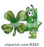 Dollar Bill Mascot Cartoon Character With A Green Four Leaf Clover On St Paddys Or St Patricks Day