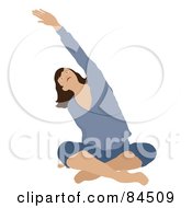 Brunette Caucasian Woman Sitting Cross Legged On The Floor And Stretching While Doing Yoga