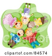 Group Of Happy Diverse Children Laying On Their Backs In Grass Looking Up