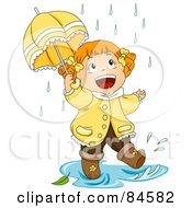 Happy Little Girl Walking Through A Puddle In The Rain
