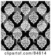 Seamless Repeat Background Of Black And White Crest Designs On Black