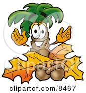 Clipart Picture Of A Palm Tree Mascot Cartoon Character With Autumn Leaves And Acorns In The Fall
