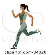 Fit And Healthy Indian Woman Running In A Green Exercise Suit