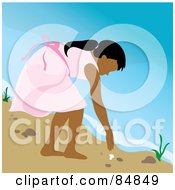 Indian Girl Bending Over To Pick Up A Seashell On A Beach