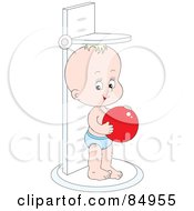 Happy Little Baby Holding A Red Ball And Standing On A Height Scale