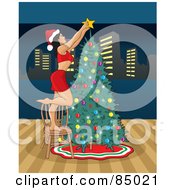Poster, Art Print Of Sexy Christmas Woman Putting The Star On Top Of Her Christmas Tree With A View Of The City