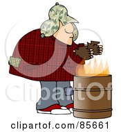 Homeless Man Warming His Hands Over A Trash Can Fire