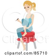 Pretty Caucasian Woman Sitting On A Stool And Painting Her Toes During A Home Pedicure