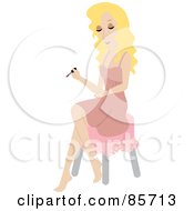 Pretty Caucasian Woman Sitting On A Stool And Painting Her Hands During A Home Manicure