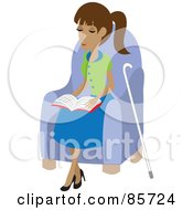 Blind Hispanic Woman Sitting In A Chair And Reading Braille Her Cane At Her Side