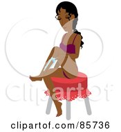 Indian Woman Sitting On A Stool And Shaving Her Legs