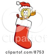 Broom Mascot Cartoon Character Wearing A Santa Hat Inside A Red Christmas Stocking by Mascot Junction